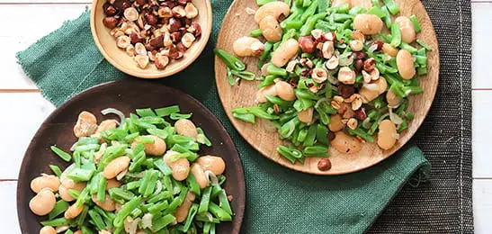 Recept van het Voedingscentrum: Snijbonen met witte bonen en hazelnoten