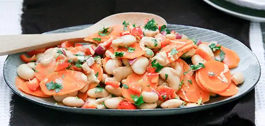 Afbeelding van Uitgelicht Recept: Wortelsalade met limabonen en tahindressing